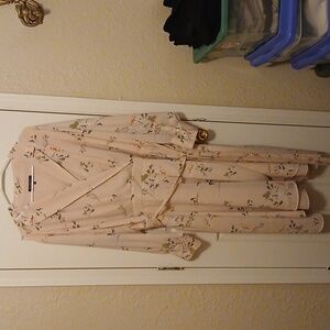 Pink with flowers, long sleeve,  V neck, tie goes around,  says 20w I'd say 22w.